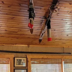 two skis hanging from the ceiling