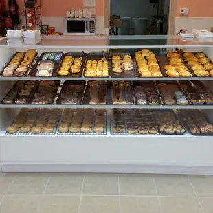 a counter with a variety of donuts