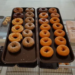 two trays of doughnuts