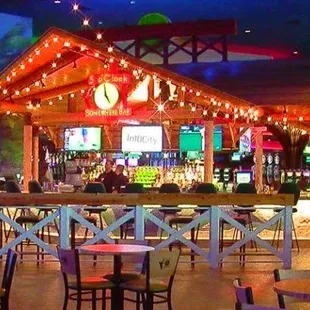 a bar with tables and chairs