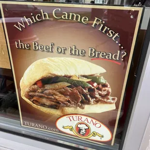 a sign in the window saying which came first the beef on the bread?