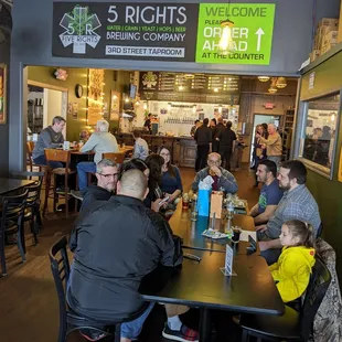 a large group of people sitting at tables