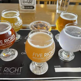 five beers on a tray