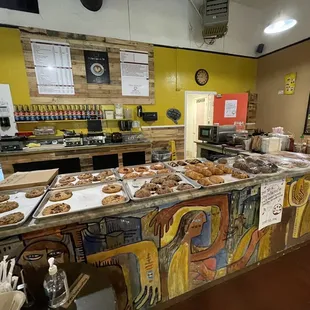 a counter with a variety of pastries