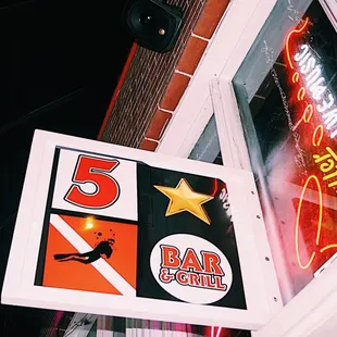 a neon sign for 5 star dive