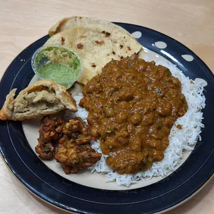 Channa Masala, vegetarian pakora and samosa, roti