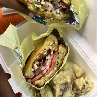Breakfast sandwich  with a side of potatoes