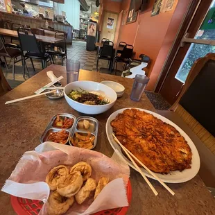 Top: beef bibimbop Right: kimchi pancake  Left: free sides (kimchi, fish cakes, sweet potato) Bottom: fried kimchi dumplings.