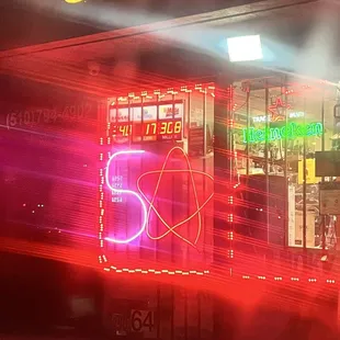 a neon sign in front of a store