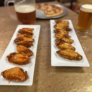 On the left you have Mild wings and Mango Habanero on the right. Medium Pepperoni in the background.