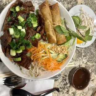 Vermicelli with egg roll and grilled pork