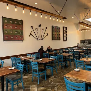 a dining room with blue chairs