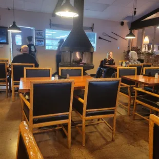 Part of the diningroom with a real woodfire. The kitchen has a huge window