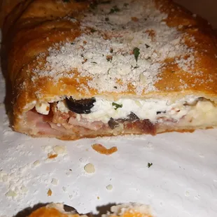 WITH ham, bacon and olives.