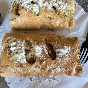 This is ONE stromboli-cut in half. That's right, ONE.