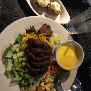 a plate of food and a glass of water