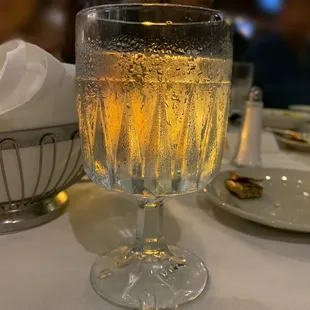 a glass of wine on a table