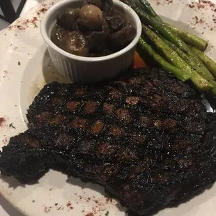 a plate of steak and asparagus