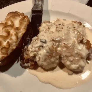 Gourmet Chicken with a white cream sauce and twice baked potato