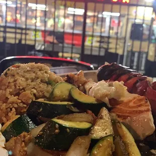 Lobster and ribeye plate that comes with a side of vegetable and chicken fried rice (also includes the free promo salmon).