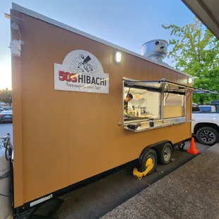 a food truck parked in a parking lot