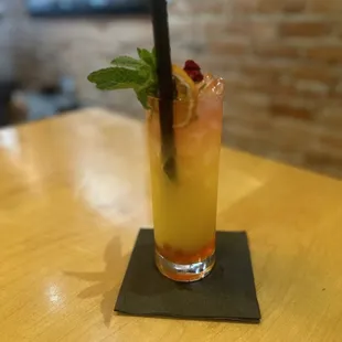 BURSTING SUNRISE Coconut Rum + White Rum + Hibiscus Rose Tea + Orange Juice + House Grenadine + Fresh Lime + Bursting Strawberry Boba