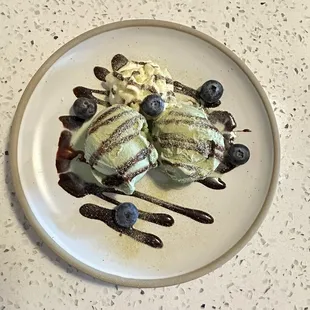 a dessert with ice cream and blueberries
