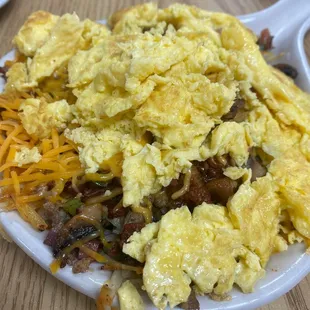 a plate of scrambled eggs and hash browns