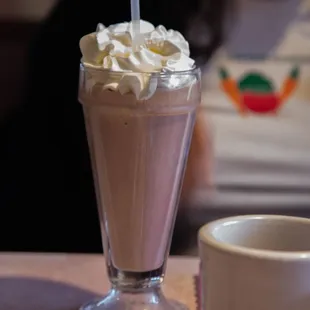 a milkshake and a cup of coffee