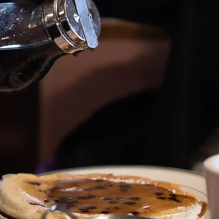 a plate of pancakes and coffee