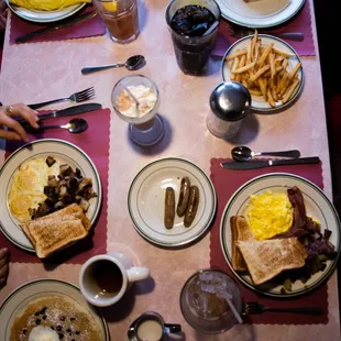 a table full of breakfast foods