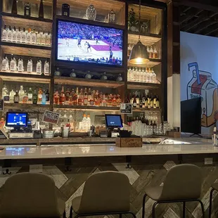 a bar with a large screen tv