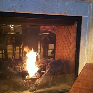 Nice warm fire next to the table on a cold winter evening