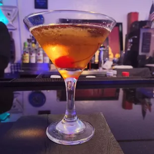 a cocktail in a martini glass