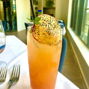 The Golden Red Dragon - Lychee vodka, St Germain, Prosecco, guava purée and mint.