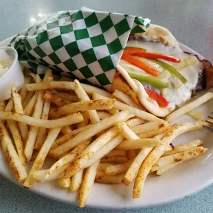 A gyro cheeseburger with pita bread.