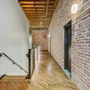 Original factory hardwood. Original factory brick exposed. Exposed wood beams. High ceilings
