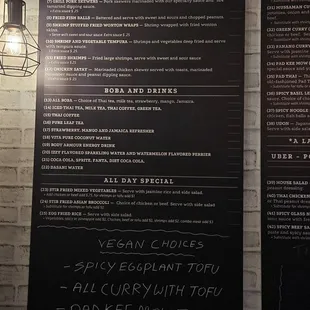 a menu on a brick wall