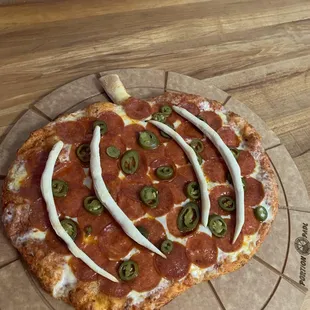 pumpkin shaped pizza. only at 525 pizza. reserve yours ahead of time for Halloween