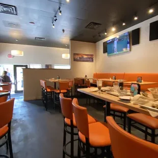 This is the seating area next to the bar .