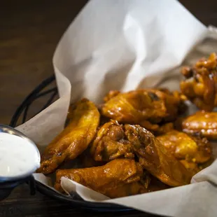 5280 Wings: Deliciously fresh wings tossed in any of our three sauces: honey sriracha, Thai-style or buffalo.