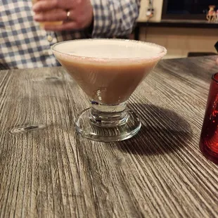 a man holding a drink