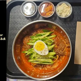 a bowl of ramen with a hard boiled egg