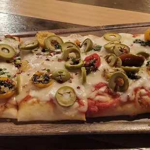 Margherita flatbread with green olives