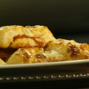 OUR ONE OF A KIND STUFFED BREAD STICKS.
THESE ARE STUFFED WITH CHEESE &amp; PEPPERONI.