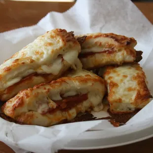 OUR ONE OF A  KIND STUFFED BREAD STICKS: THESE ARE STUFFED WITH CHEESE &amp; PEPPERONI.