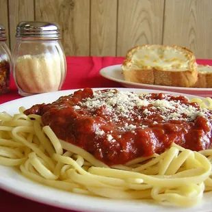 WE HAVE HOMEMADE SAUCE FOR OUR SPAGHETTI, IT IS SERVED WITH FRESHLY TOASTED GARLIC BREAD.