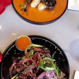 Short Ribs with rice (front) &amp; Lamb chops on a curry sauce (back).