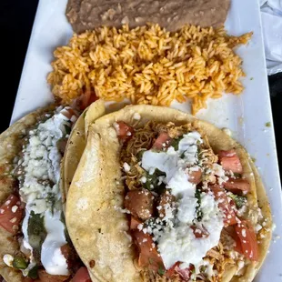 Street tacos. One chicken and one ground beef,