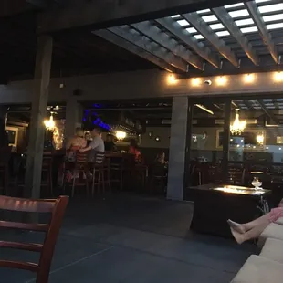 a group of people sitting at a bar